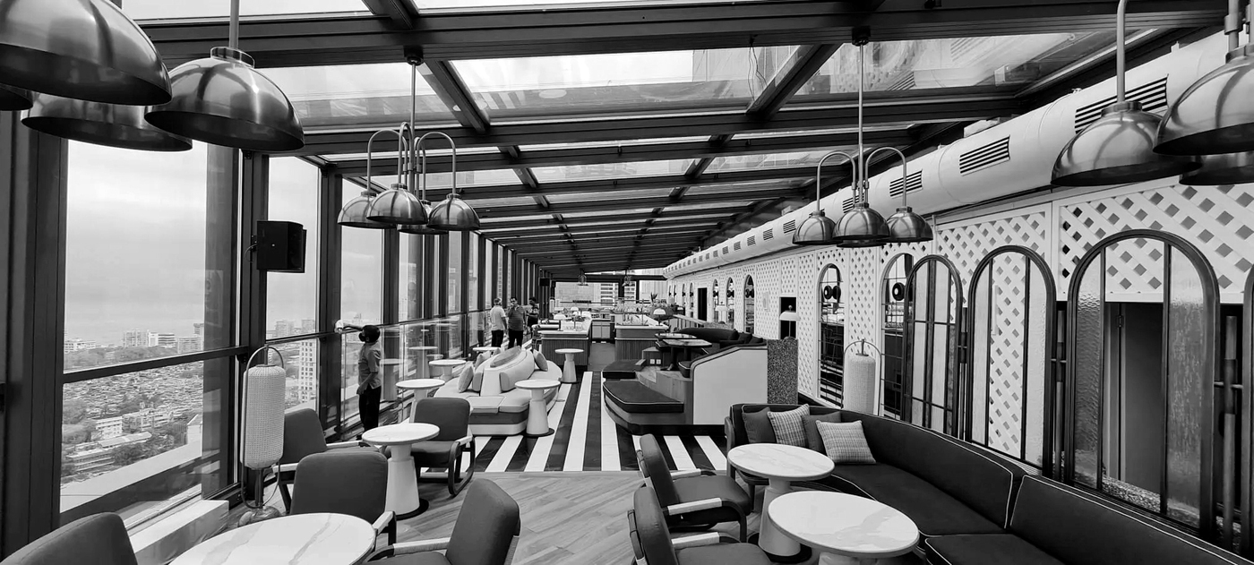 Mumbai rooftop lounge with arched glazing
