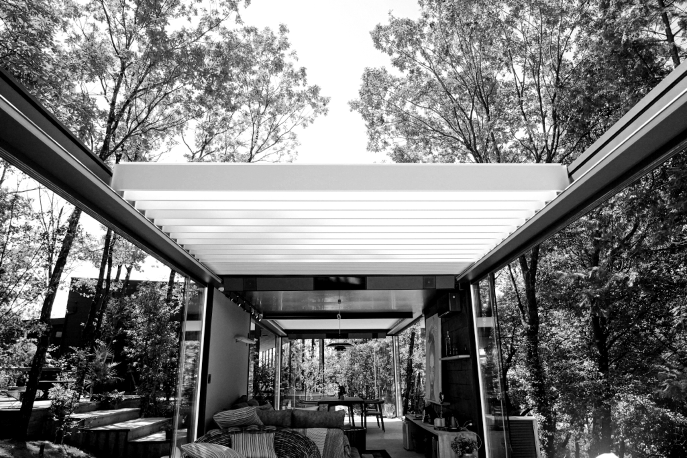 Bioclimatic pergola in forest setting